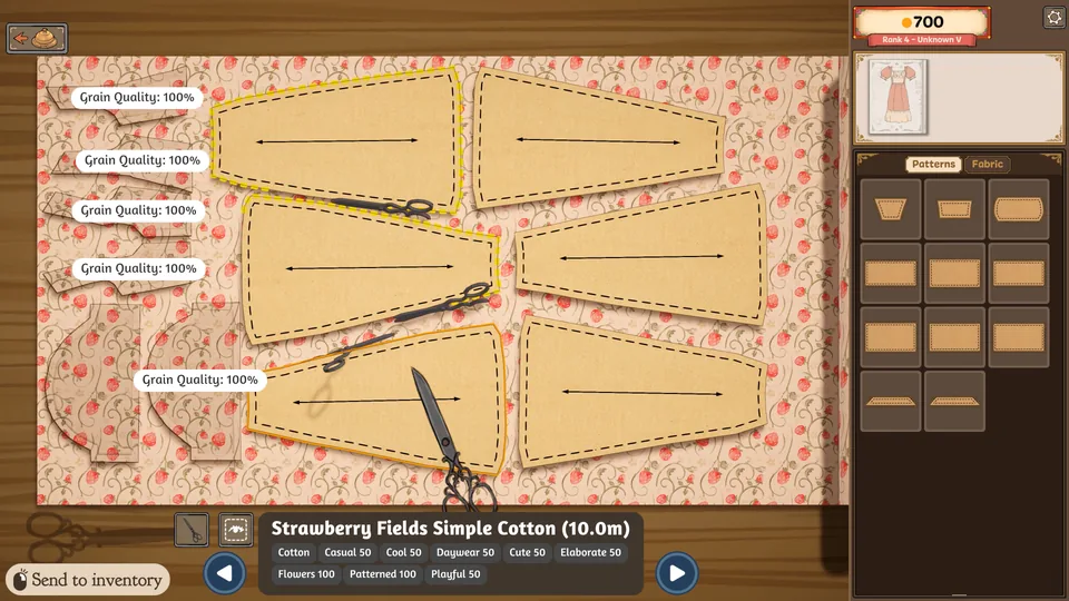 Paper garment patterns and grain-direction arrows laid on strawberry-print fabric in the desktop game